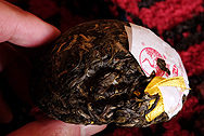 Xiaguan Green Tuo Cha, Golden label, Snow mountain photo:Puerh tea leaf